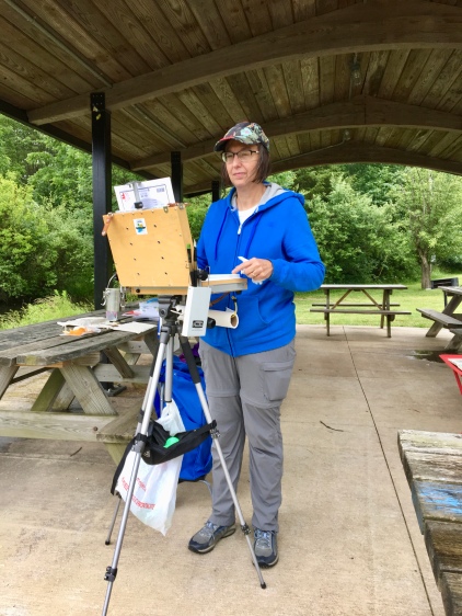 A sturdy shelter by the Wildlife Management Pond provided the ideal spot to paint despite rain showers.